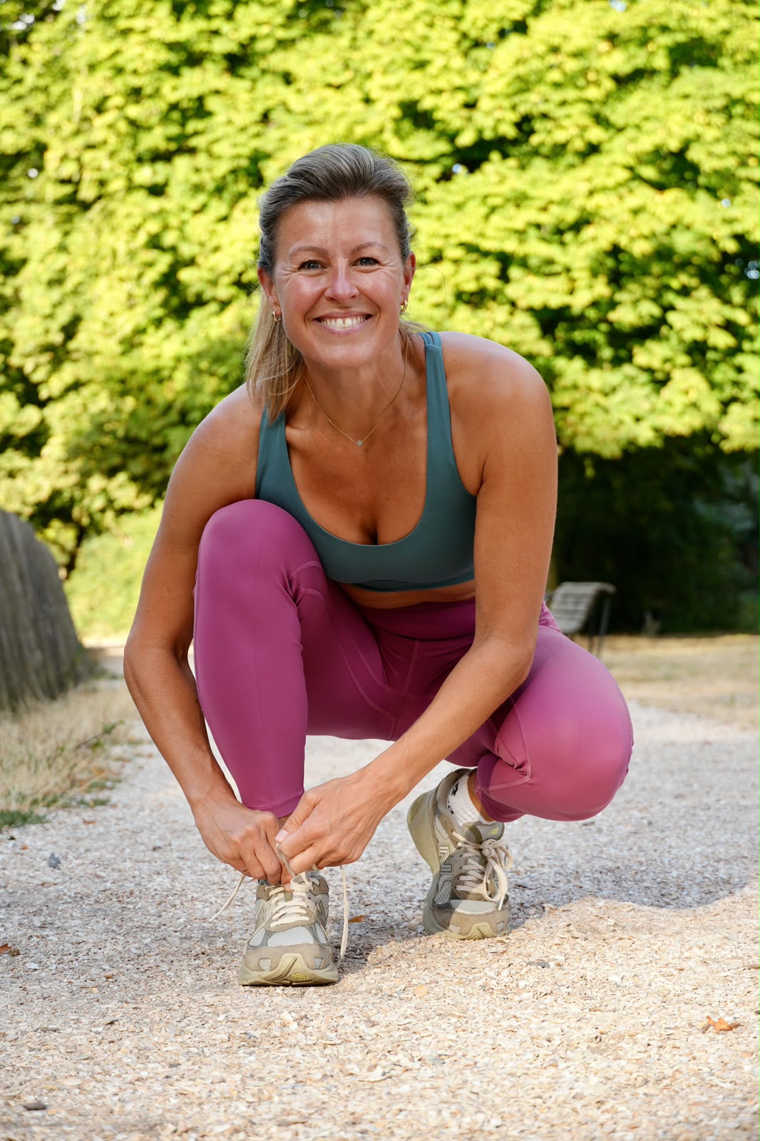 Esther van Diepen lacing her running shoes before a run